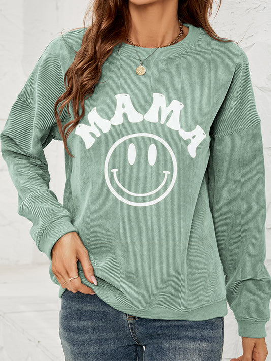 Corded sweatshirt in green with smiley face and says "MAMA"