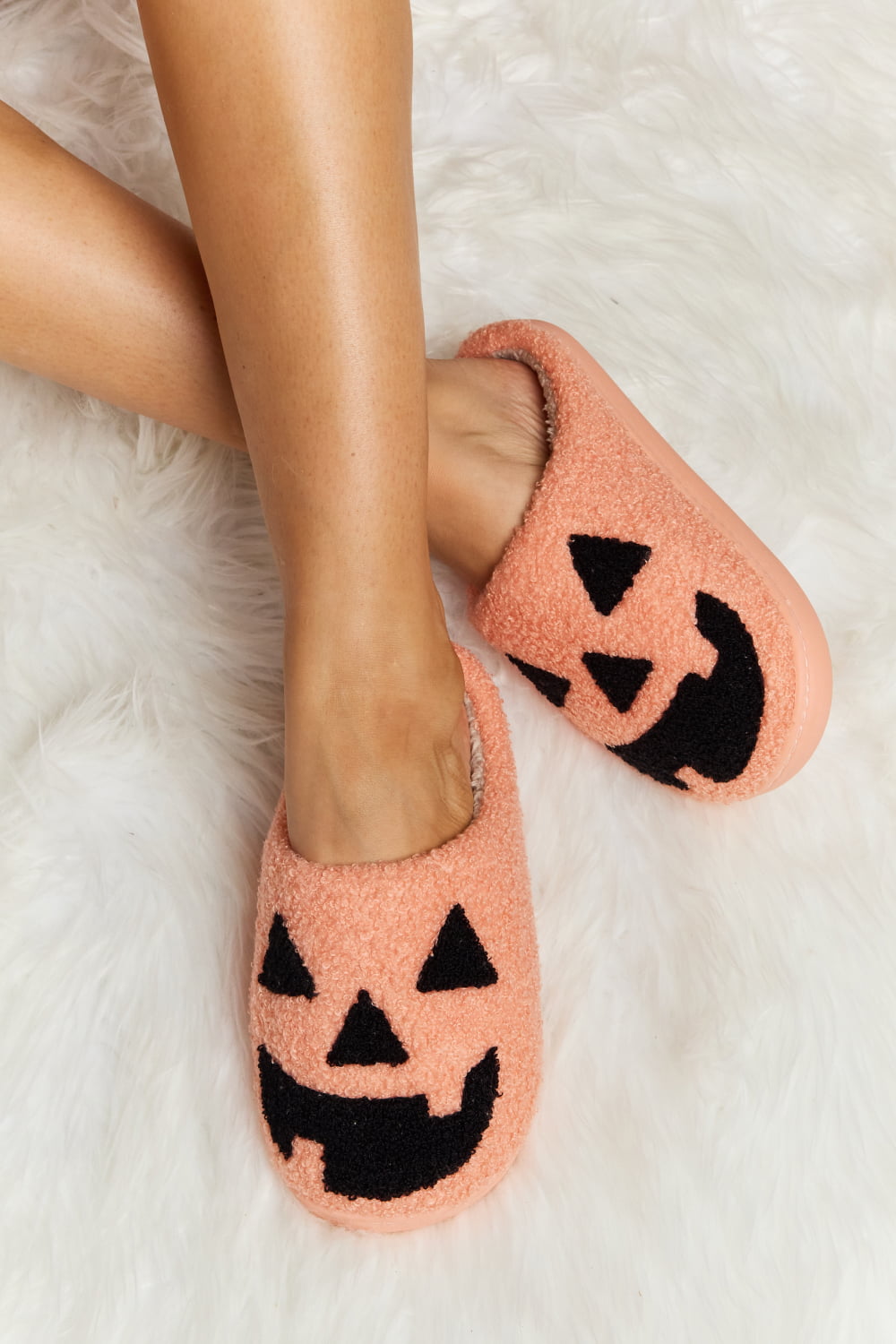 womens halloween slippers with a pumpkin face