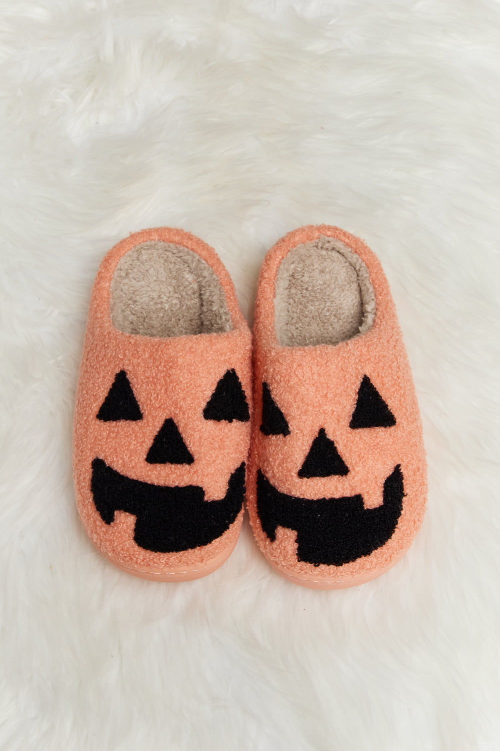 orange Slippers with a pumpkin face