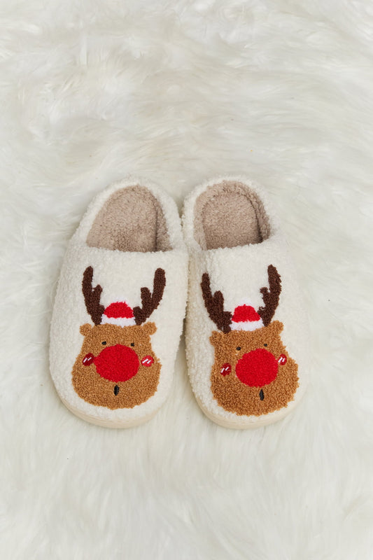 christmas slippers with a  rudolph face and red nose