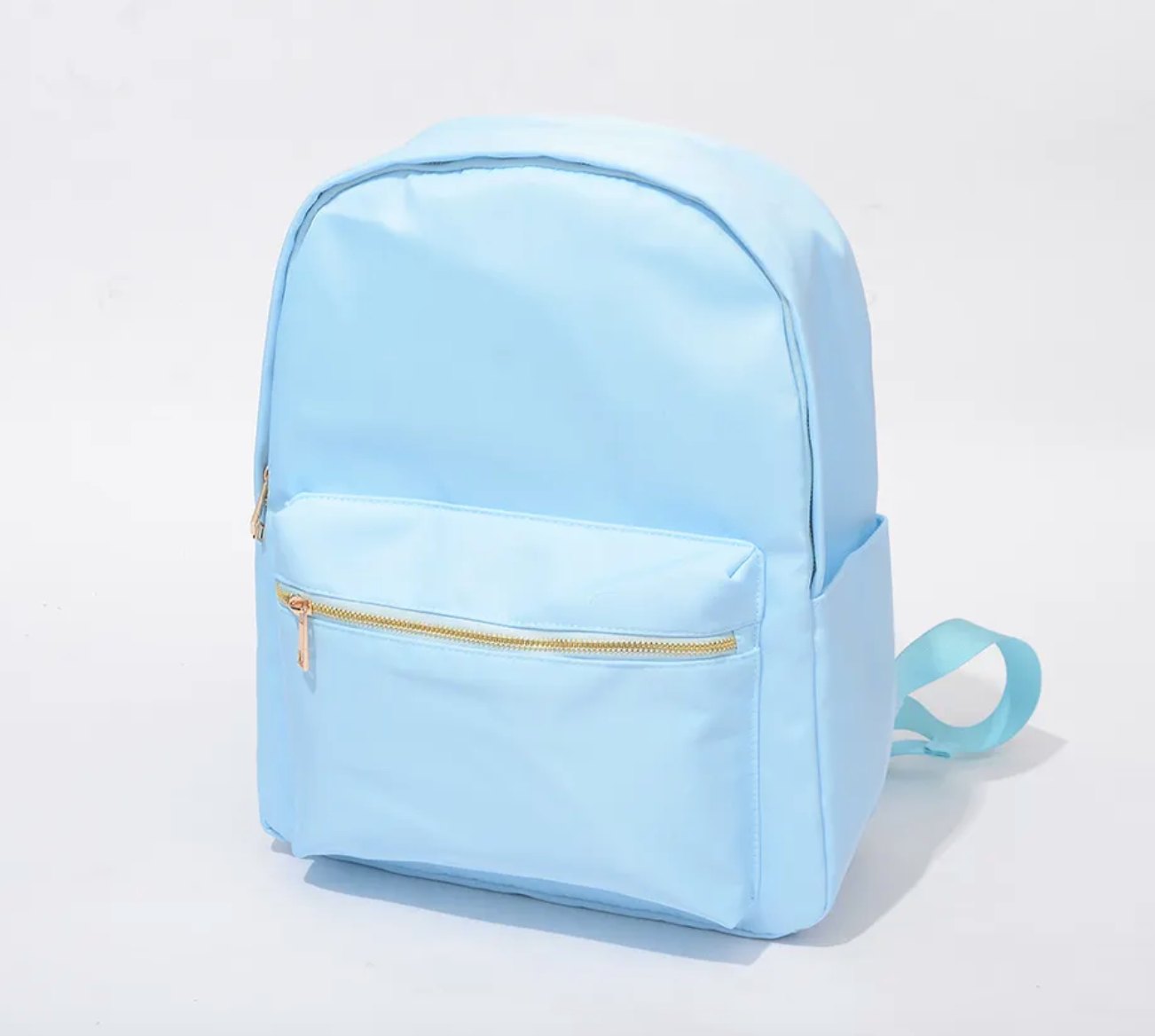 Personalized nylon backpack with patches in light blue