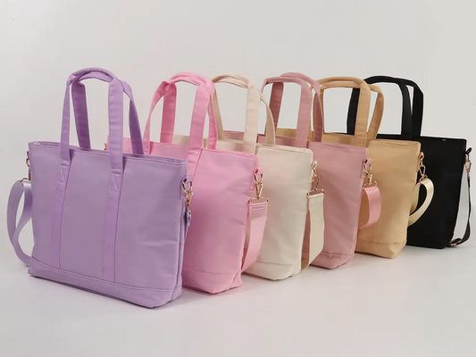 Personalized nylon tote color options are purple, light pink, beige, mauve, black, and hot pink (not shown)